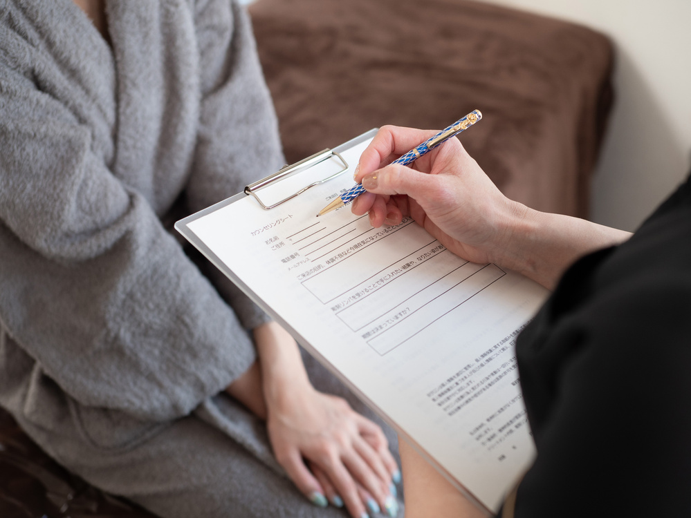 Female esthetician counseling beauty salon